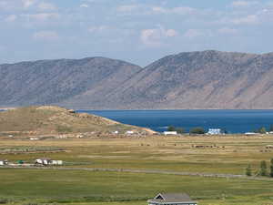 View of mountain backdrop featuring a large body of water