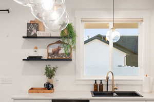 Kitchen view of light countertops and open shelves