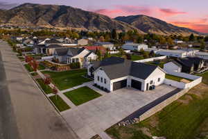 Aerial view at dusk of a residential view and a mountain view
