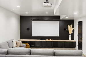 Home theater room featuring recessed lighting and baseboards