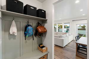 Mudroom with recessed lighting and wood finished floors