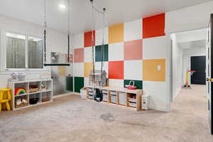 Bedroom with carpet flooring and baseboards