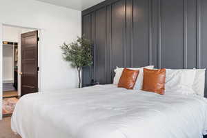 Primary bedroom with a walk-in closet