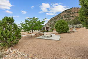 View of yard featuring a mountain view and a patio area
