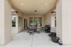 View of patio / terrace with outdoor dining area and a grill