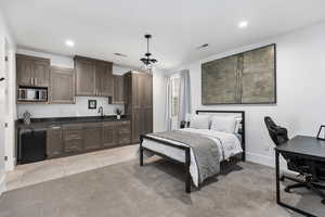 Bedroom featuring an office area, recessed lighting, and light tile patterned floors