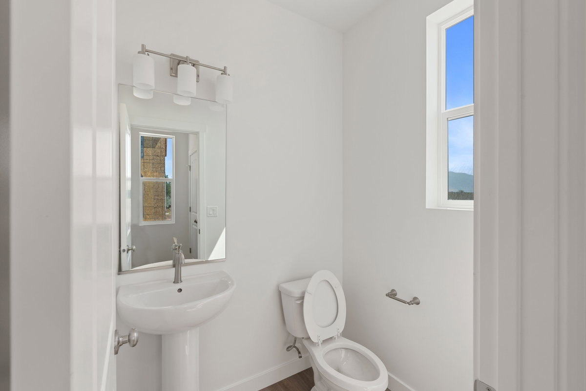 Bathroom featuring toilet and wood finished floors