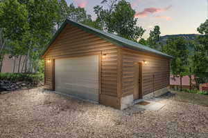 Detached garage featuring a mountain view