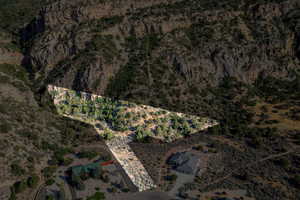 Aerial view of property and surrounding area featuring a desert landscape