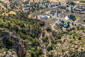 Aerial view of property and surrounding area featuring a desert landscape