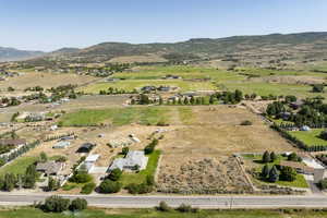 Overview of rural landscape featuring a mountain backdrop