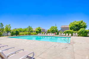 Community pool with a patio area