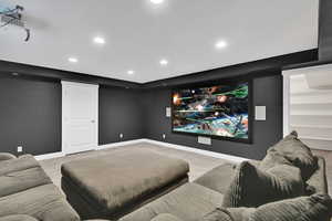 Home theater featuring carpet and recessed lighting
