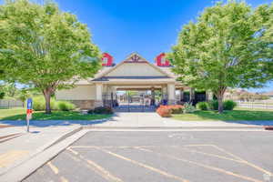 View of property with uncovered parking