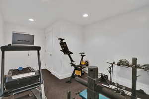 Exercise room with recessed lighting and carpet floors