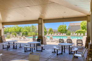 View of patio featuring a community pool