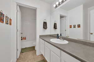 Full bathroom featuring vanity, tile patterned floors, and bathtub / shower combination