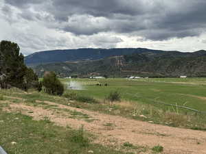 View of mountain background featuring rural landscape