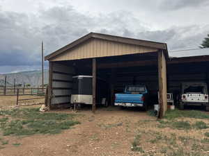 View of outdoor structure featuring a detached carport and a mountain view