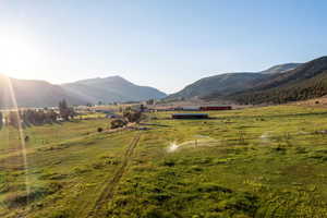 View of mountain backdrop with rural landscape and a pastoral area