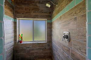 Bathroom with a tile shower