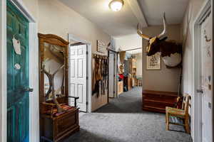 View of carpeted foyer