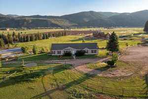View of mountain background featuring rural landscape