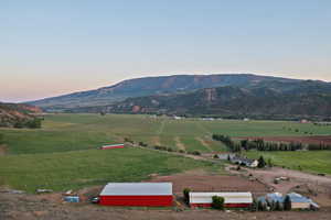 View of mountain backdrop with rural landscape