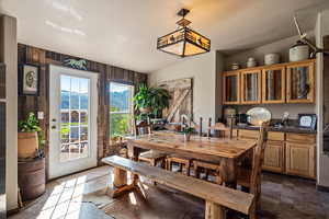 Dining area with dark stone finish flooring