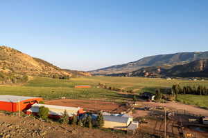 View of mountain backdrop featuring rural landscape