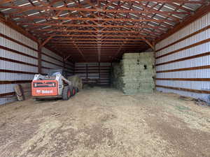 Garage featuring metal wall