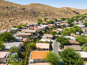 Aerial view of residential area featuring a mountainous background
