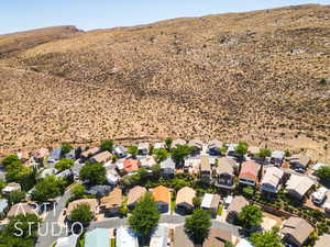 Aerial perspective of suburban area with mountains and a desert landscape