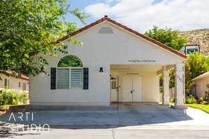 Mediterranean / spanish home with stucco siding