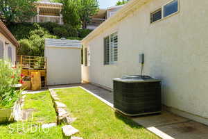 View of yard with a storage shed
