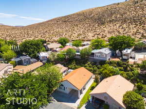 Aerial perspective of suburban area with a mountainous background