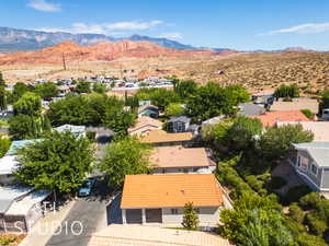 Aerial view of residential area featuring a mountainous background