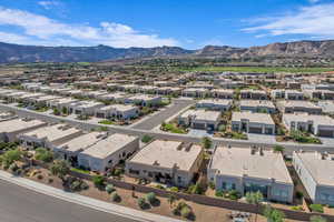 Aerial perspective of suburban area featuring a mountainous background