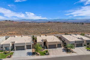 Aerial view of residential area featuring mountains