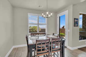 Dining room featuring a chandelier and wood finish floors
