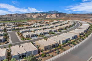 Aerial perspective of suburban area featuring a mountain backdrop