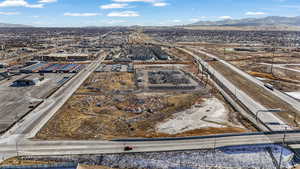 Aerial view of a major roadway and a mountain backdrop
