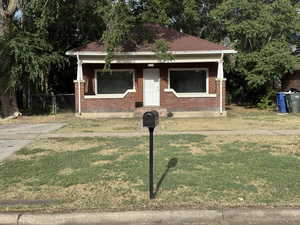 View of front facade featuring brick siding