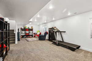 Workout area featuring carpet and recessed lighting