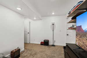 Interior space with carpet flooring and recessed lighting