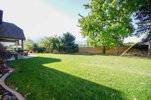 Fenced backyard with a patio and a mountain view