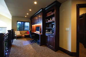 Office space with carpet and recessed lighting