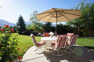 View of patio / terrace with outdoor dining area and a mountain view