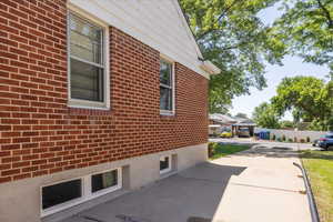 View of north side of property featuring RV or extra parking driveway