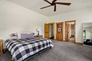 Carpeted bedroom with ceiling fan and recessed lighting